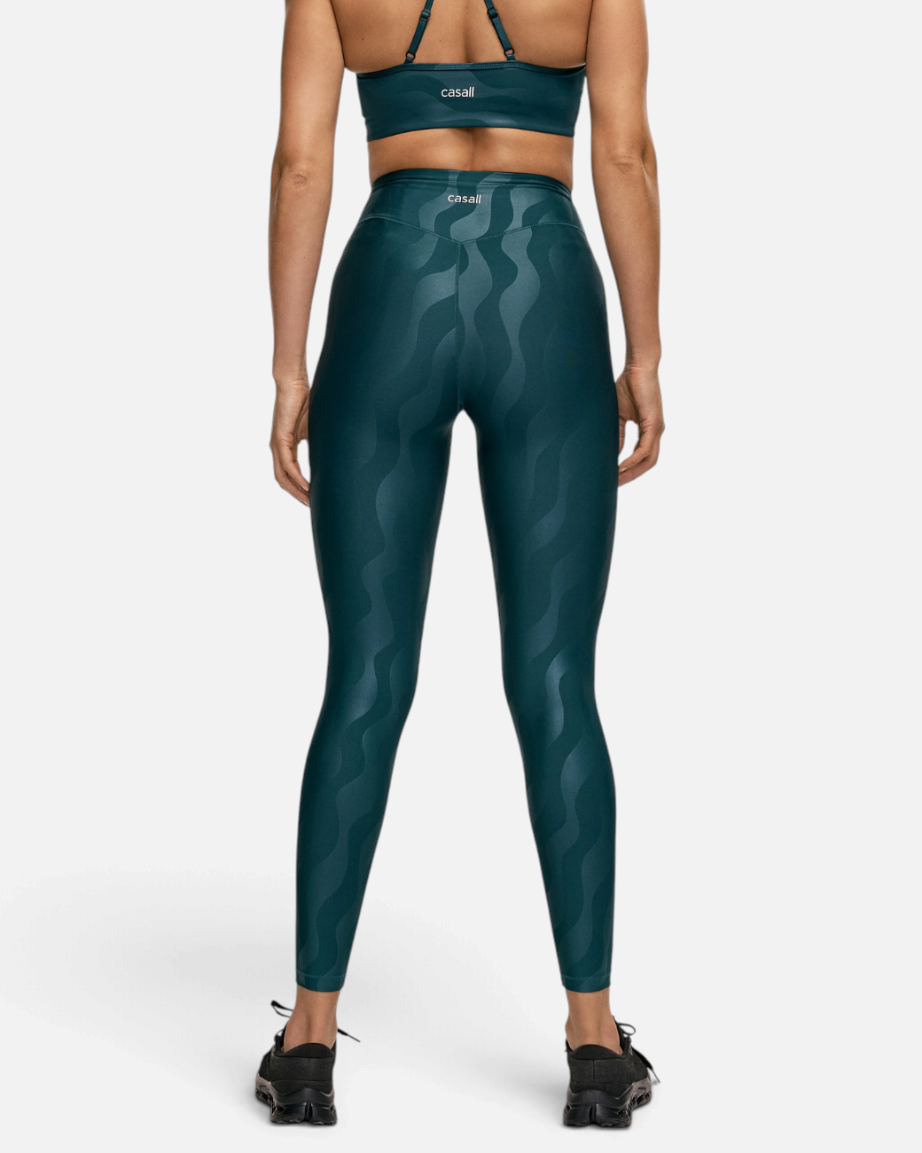 greenyogashop Heat Printed High Waist Tights in Dunkelgrün mit grafischem Muster und hohem Bund von hinten