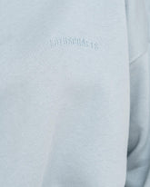 Stone Blue - Model in cropped Yoga Sweater Detail Logo Lotuscrafts