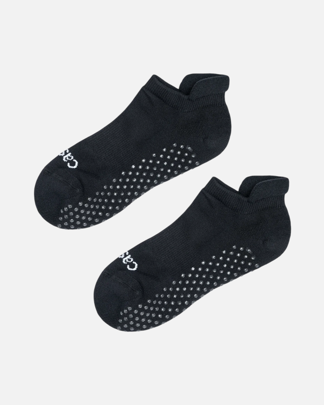 greenyogashop schwarze Anti-Rutsch-Socken aus Baumwollmix mit Silikonnoppen an der Sohle und Logo an den Zehen