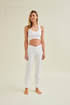 Sustainable fashion photo of cradle to cradle certified Wellicious white yoga pants and white yoga bra made for the biological cycle and designed for flexibility and comfort
