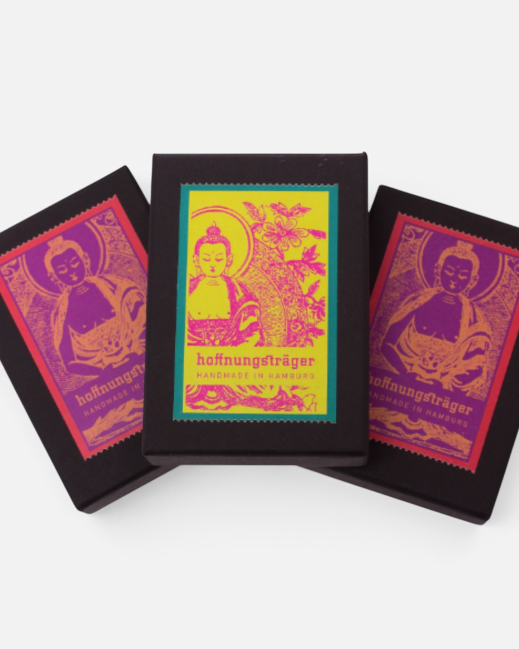 Drei schwarze hoffnungsträger Buddha Geschenkboxen mit buntem Buddha-Druck für Schmuck